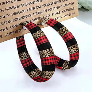 Red buffalo check and leopard print statement hoop earrings.