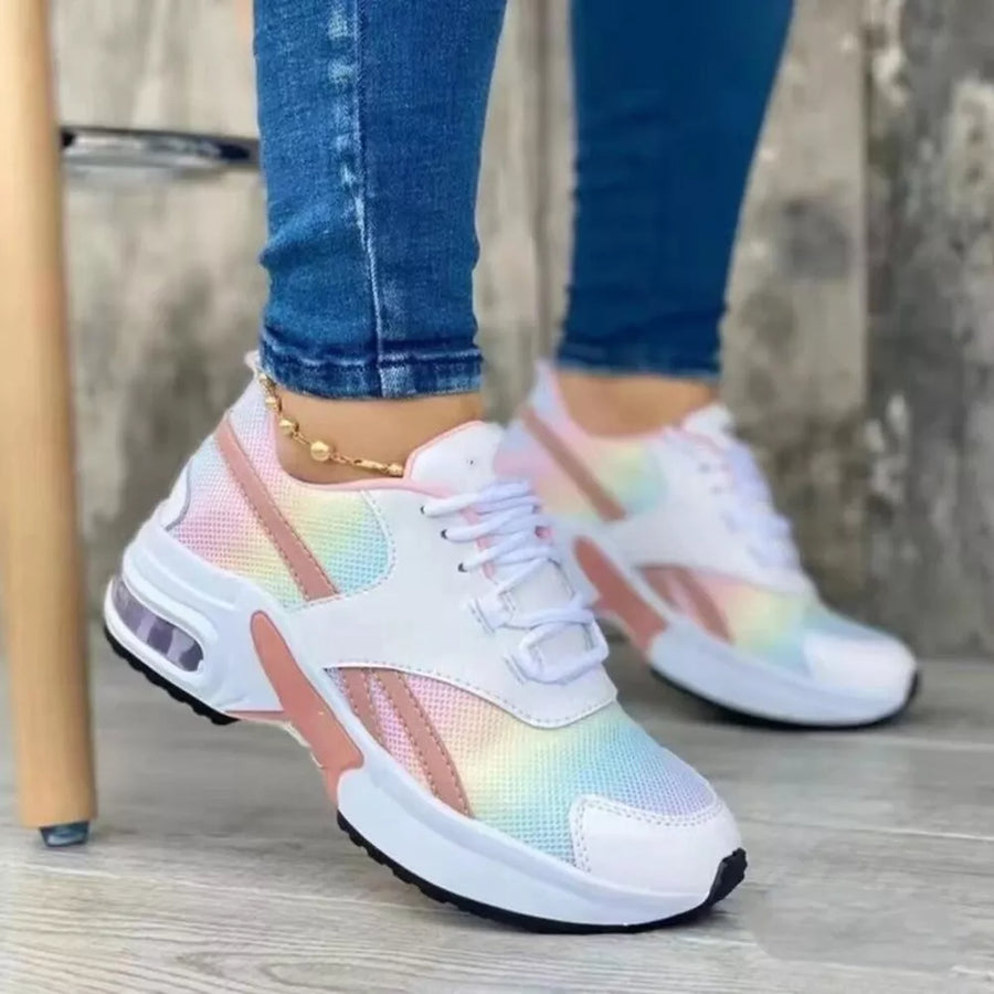 Multicolor lace up air cushion sneakers with white mesh and pink accents.