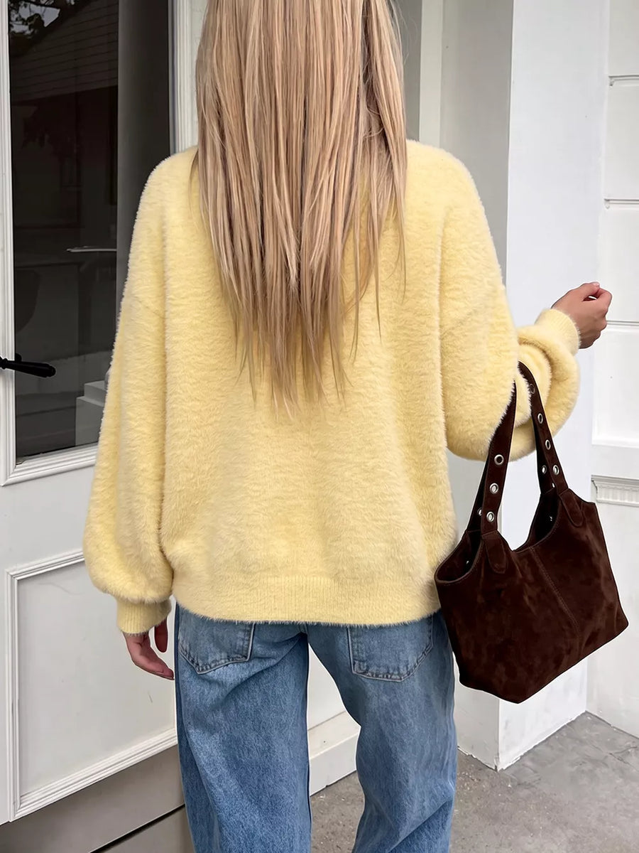 Yellow cardigan with hip-length and button-front