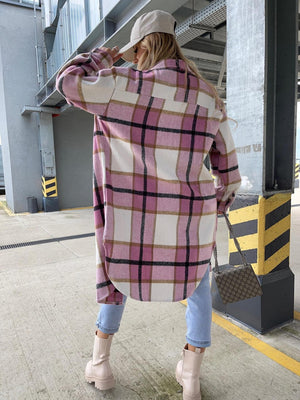 Long sleeve collared shirt jacket in pink plaid with button cuffs and curved hem.
