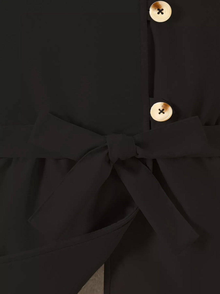 Black belted coat with bow detail and wooden buttons.