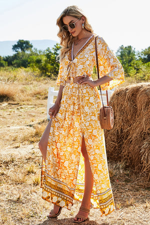 Bohemian floral print crop top with tie front and maxi skirt with high slits in tangerine.