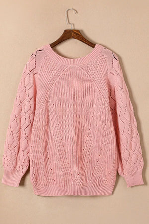 Dusty pink hollow-out knit sweater with puffy sleeves and diamond pattern detail.