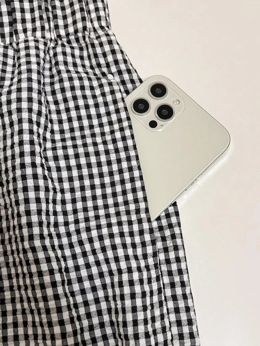 Plaid two-piece set with pocket detail, black and white gingham pattern.