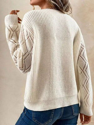 cream v-neck sweater with hip-length and pullover