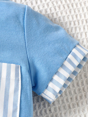 Pastel blue cotton baby tee with striped pocket and sleeve cuffs.