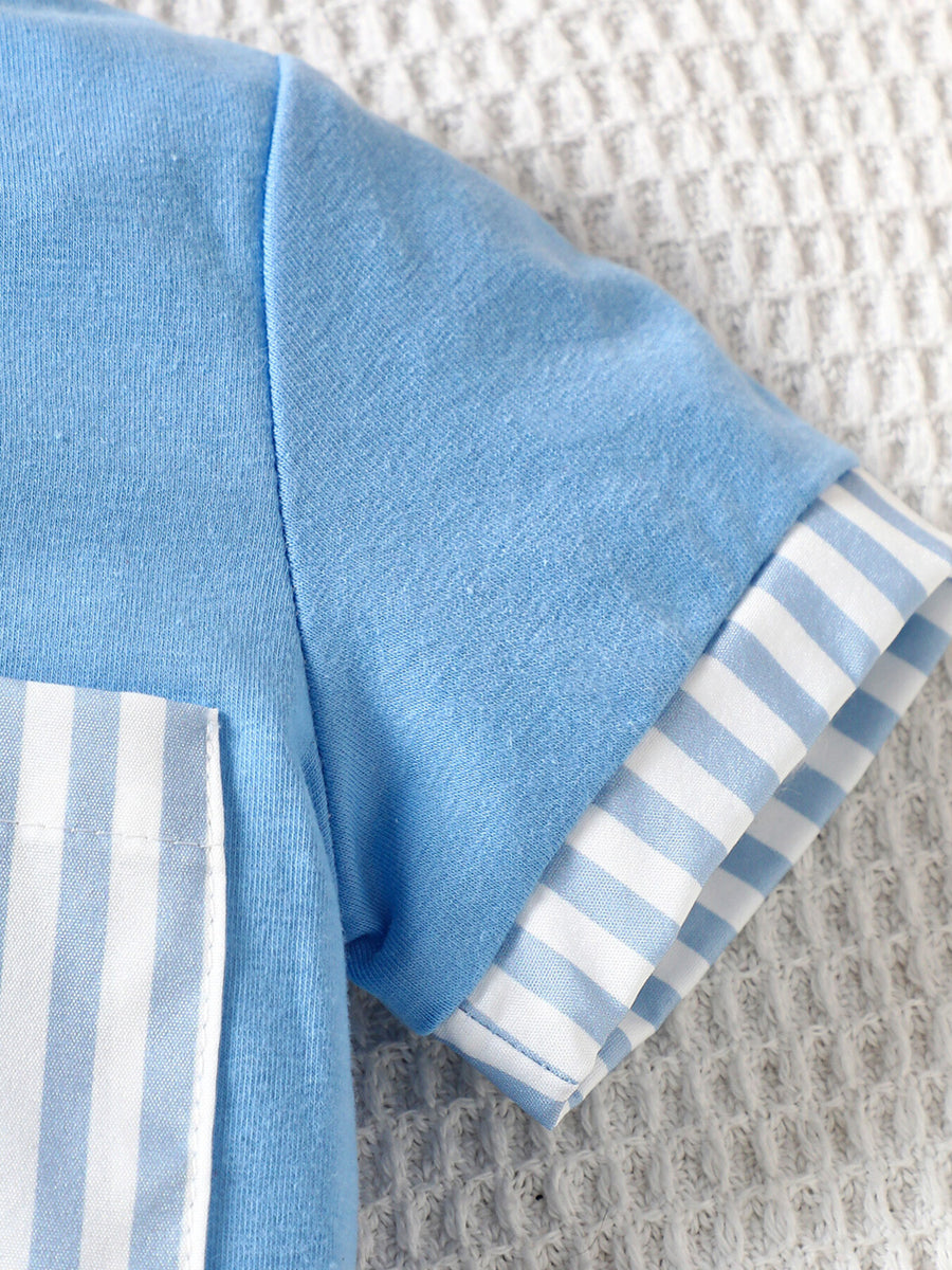 Pastel blue cotton baby tee with striped pocket and sleeve cuffs.