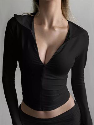Black cropped zip-up hoodie with deep V-neck and ruched shorts set.