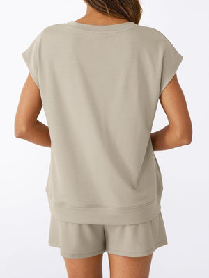 V-neck top and drawstring shorts set in apricot, with cap sleeves and a relaxed fit.