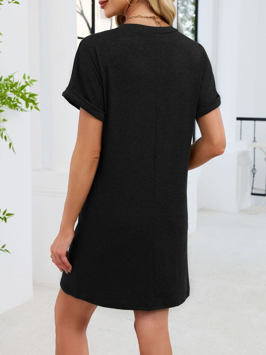 Black v-neck t-shirt dress with cuffed short sleeves and above-knee length.