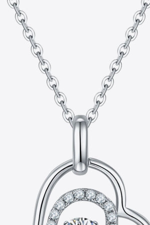 Silver floating diamond heart necklace with a delicate chain.