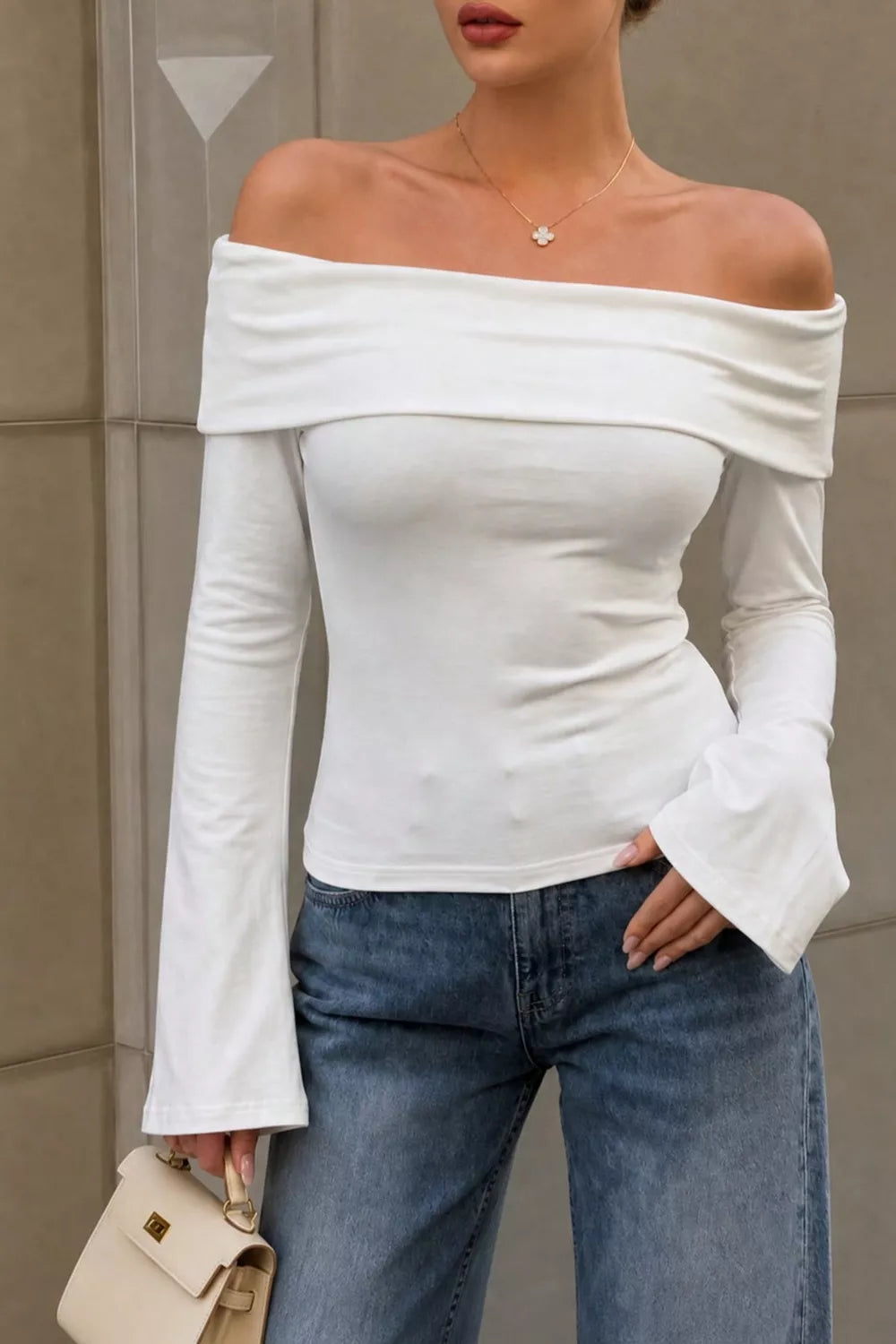 off-shoulder top in white featuring stretch and fitted fit