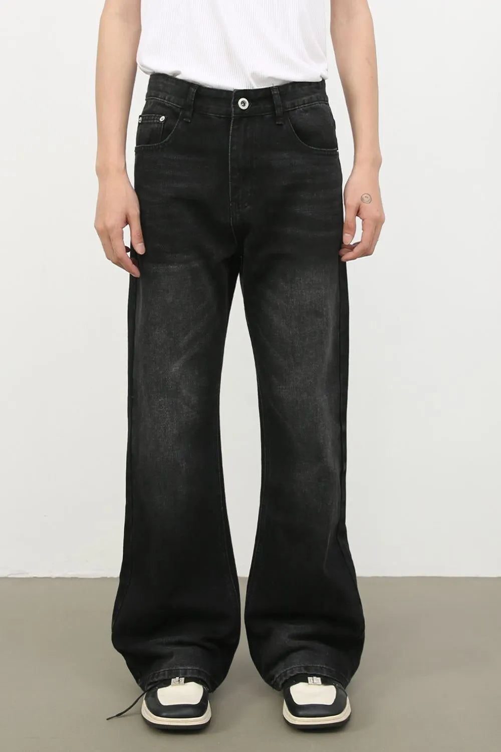 Exaggerated flare dark wash denim trousers with a wide leg