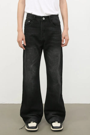 Exaggerated flare dark wash denim trousers with a wide leg
