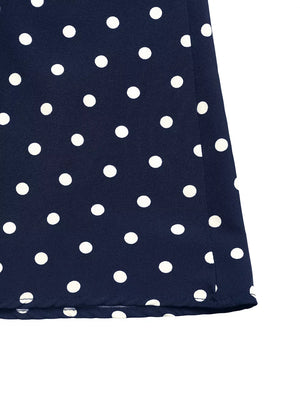 Navy polka dot A-line maxi dress hem detail