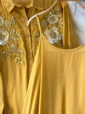 Apricot embroidered floral two-piece set with sequin details and crinkled fabric.