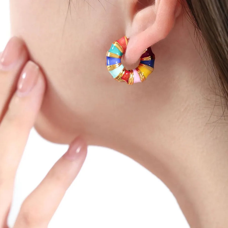 Rainbow enamel segmented hoop earrings with gold accents.