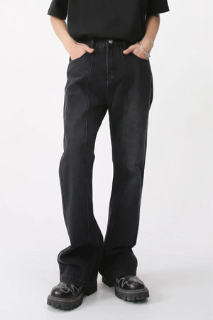Dark denim wide-leg trousers with vertical seams and a comfortable fit.
