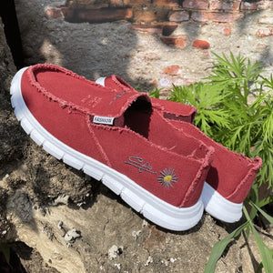 Deep Red canvas slip-on flats with raw edges and embroidered daisy detail.