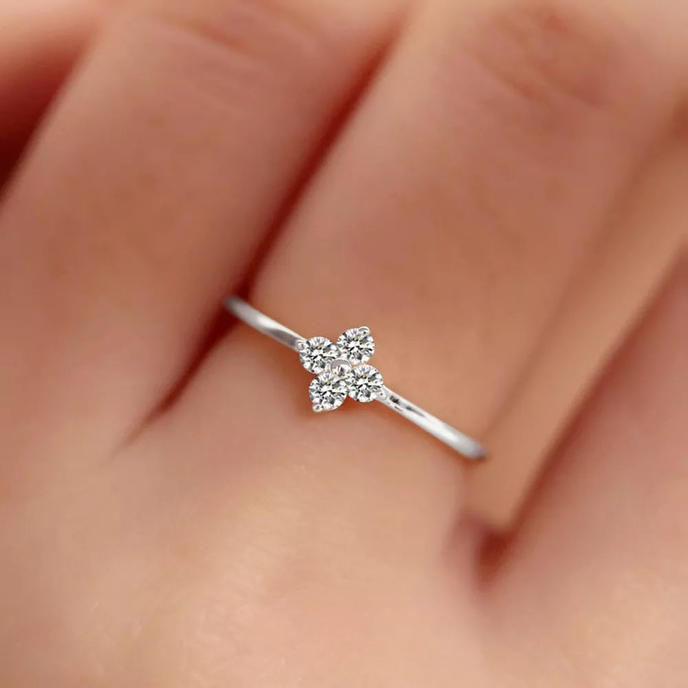 clear ring featuring zircon embellishment and four-leaf clover