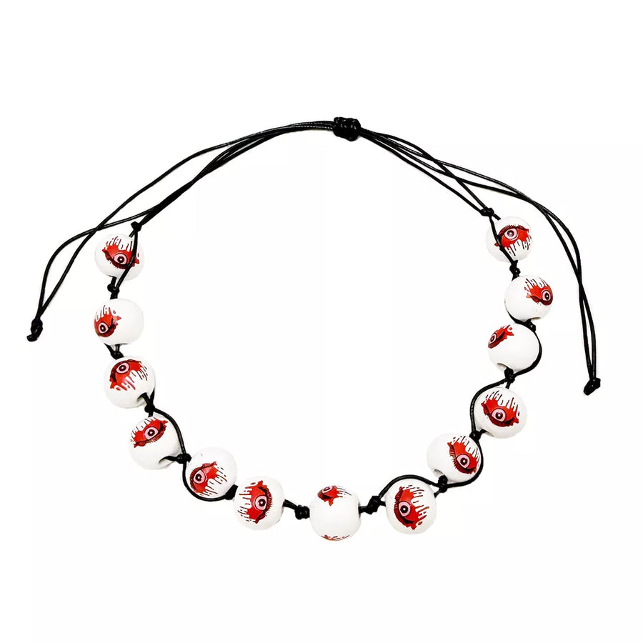 necklace in white with eyeball-print and beaded