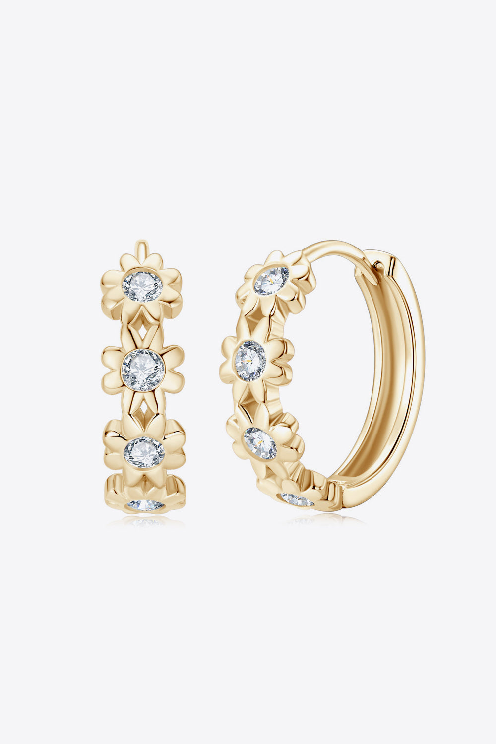 Gold huggie hoop earrings with floral embellishments and clear stones