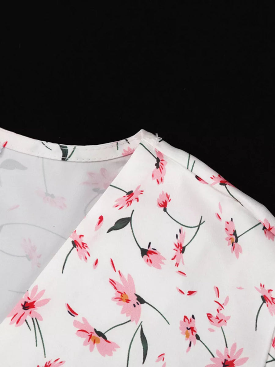White floral print v-neck blouse with pink flowers and green leaves