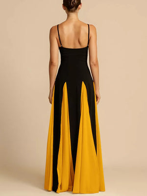 Maxi dress with spaghetti straps in black and yellow, featuring a flowing skirt with panel details.