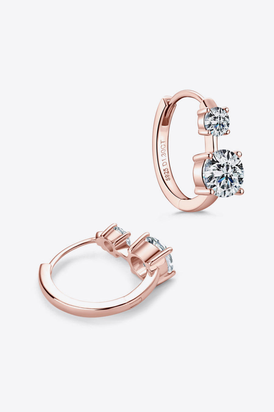 Rose gold double stone huggie hoop earrings with clear cubic zirconia stones.