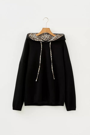 50% polyester, 45% viscose, 5% elastane Care instructions: Machine wash cold pullover hoodie in black with relaxed silhouette