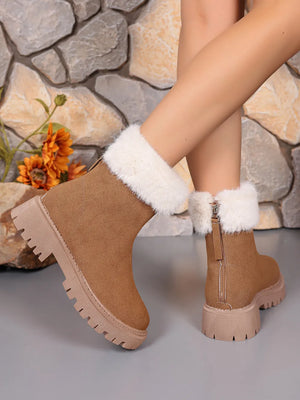 Camel suede ankle boots with white faux fur trim and side zipper.