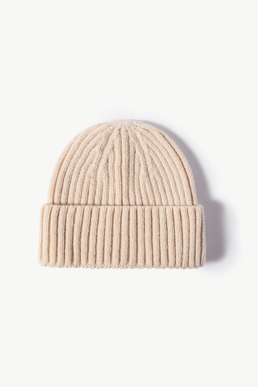 Chunky ribbed knit beanie in cream acrylic with a cuffed hem.