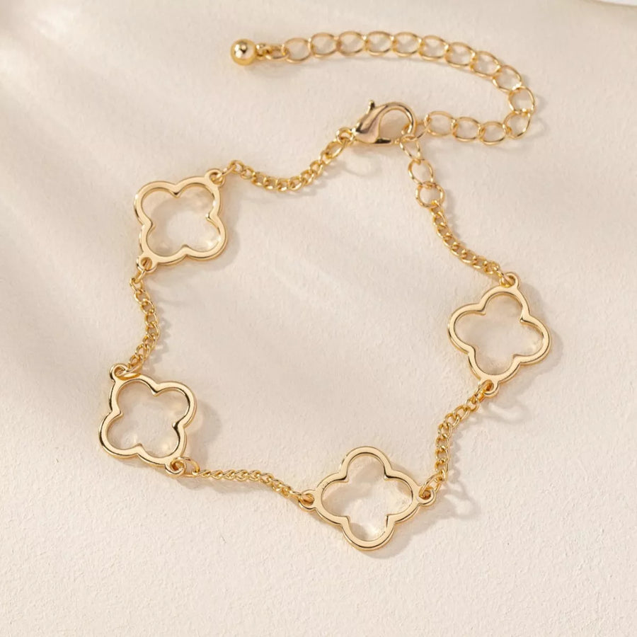 Gold four leaf clover bracelet with dainty chain and adjustable clasp