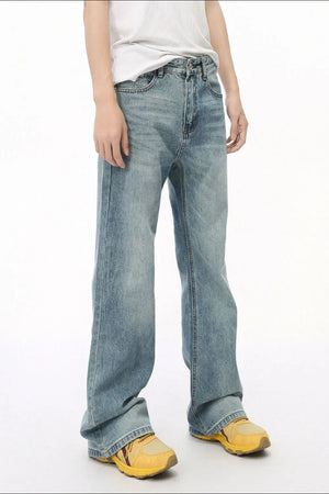 Medium wash denim bell bottom jeans with a relaxed fit.