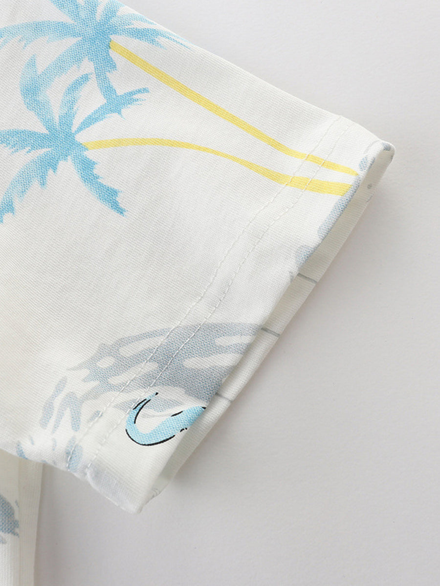 Toddler white t-shirt with blue palm trees and yellow stripes.
