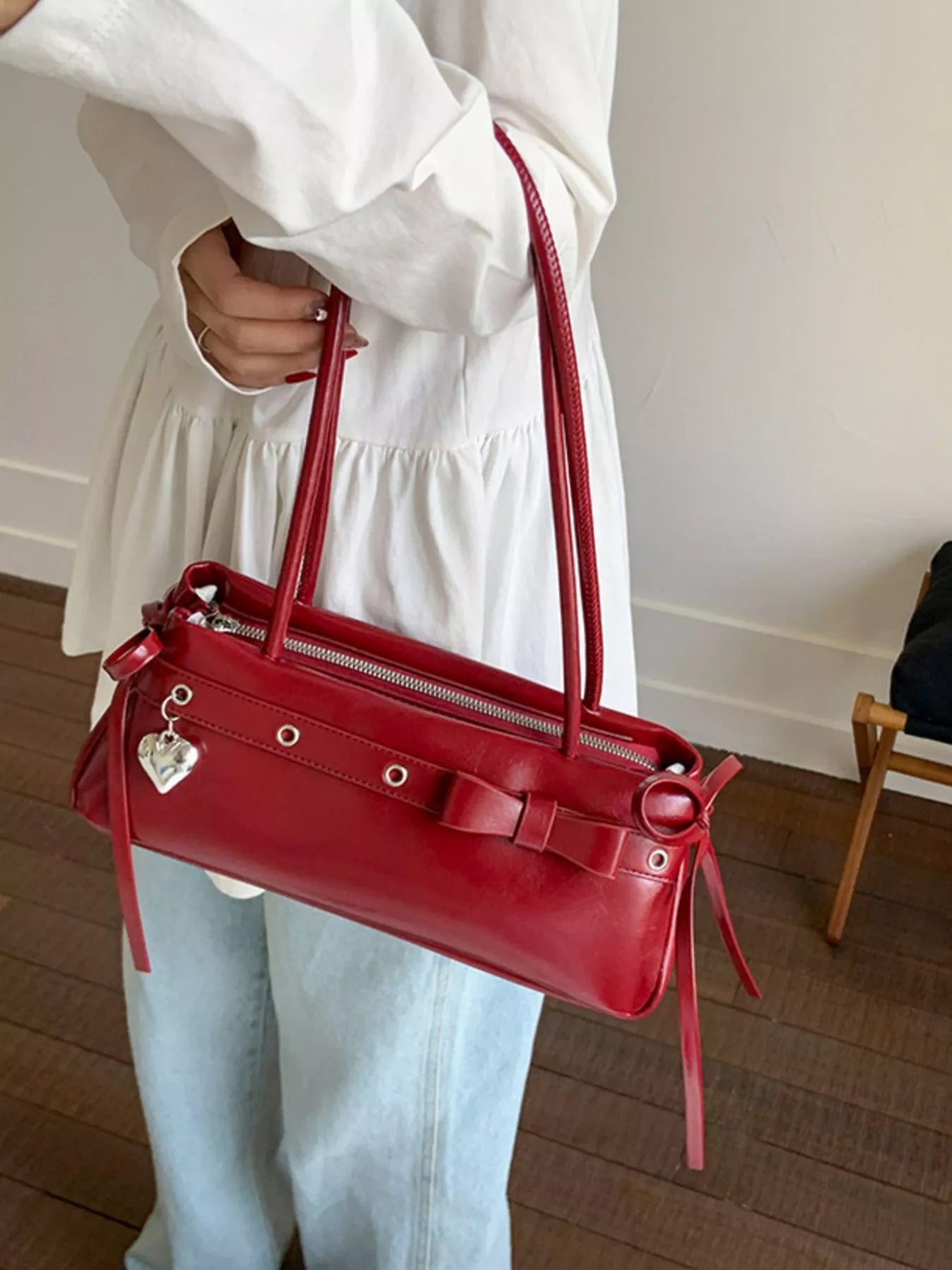 Red PU leather shoulder bag with bow detail and heart charm