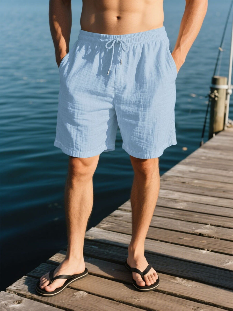 Light blue linen shorts with drawstring waist and pockets