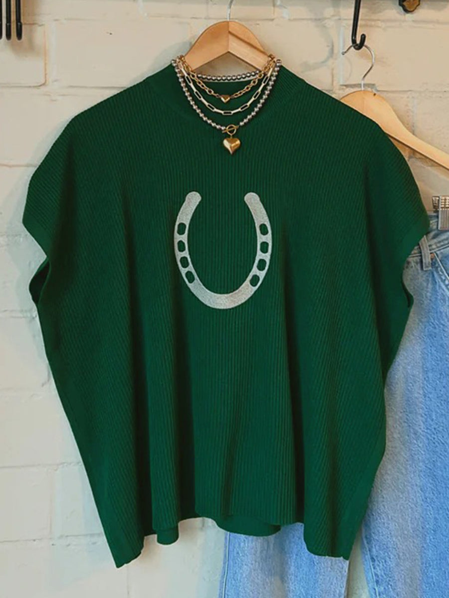 Green ribbed knit sweater with a silver horseshoe graphic and short sleeves.