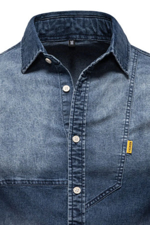 Dark wash denim shirt with asymmetric pocket detail and button-down front.