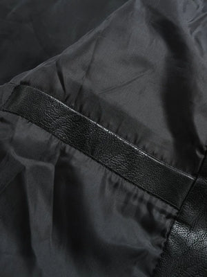 Black moto jacket detail with faux leather trim and satin lining.