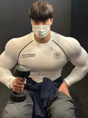 White crew neck long sleeve performance fit shirt with black trim and branding