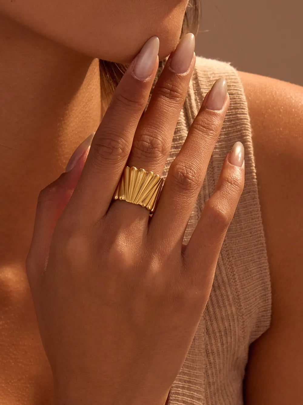 ring in gold featuring wide band and straight fit