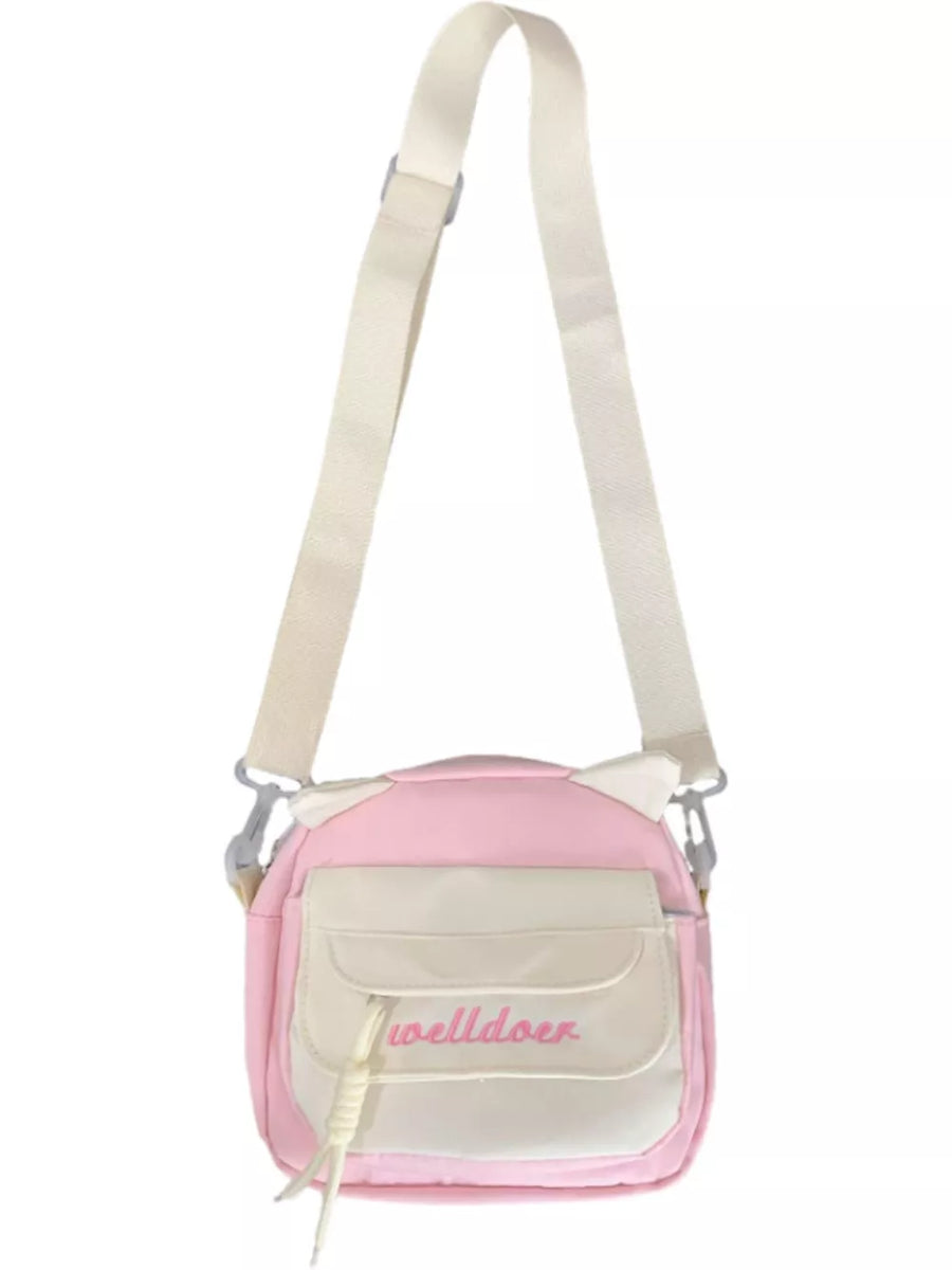 Pink crossbody bag with cat ears and adjustable strap