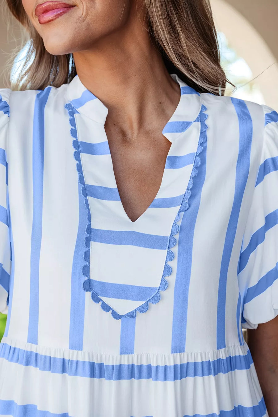 Tiered dress with blue and white stripes, ricrac trim, and ruffled details.