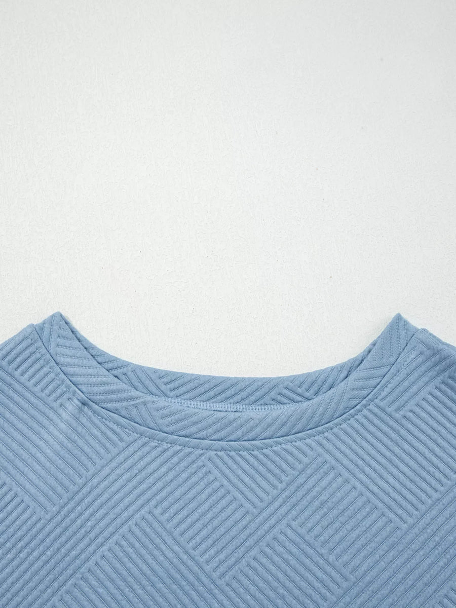 Light blue textured drawstring set with a geometric pattern and crew neck.