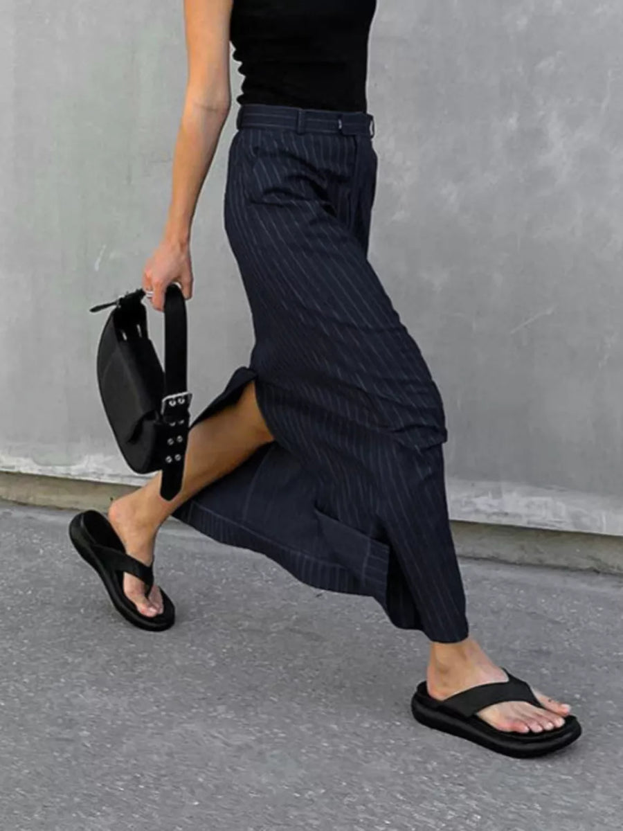 100% polyester Care instructions: Machine wash cold maxi skirt in navy blue with straight silhouette