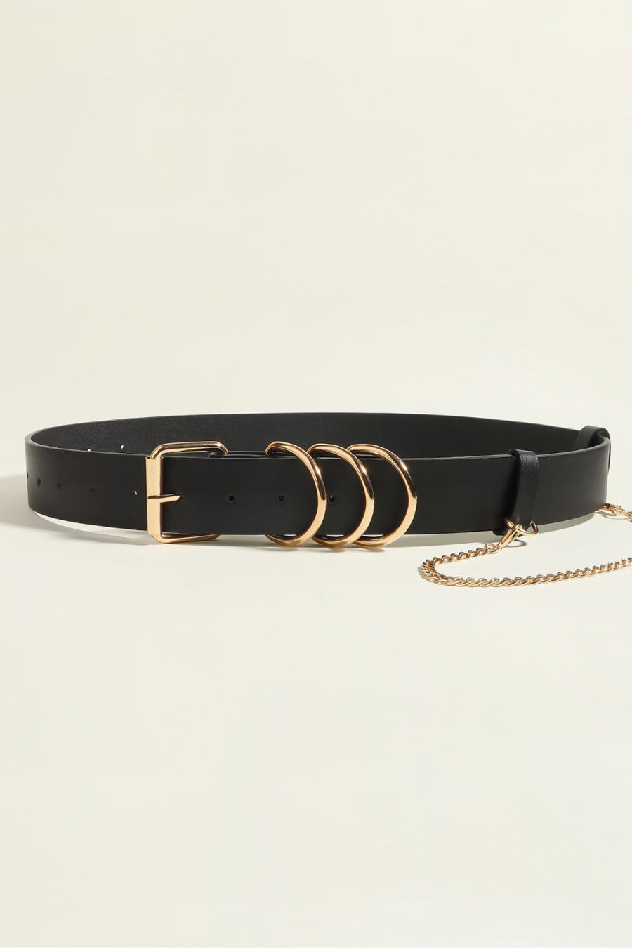 Black PU leather harness belt with gold buckle, triple ring detail, and chain accent.