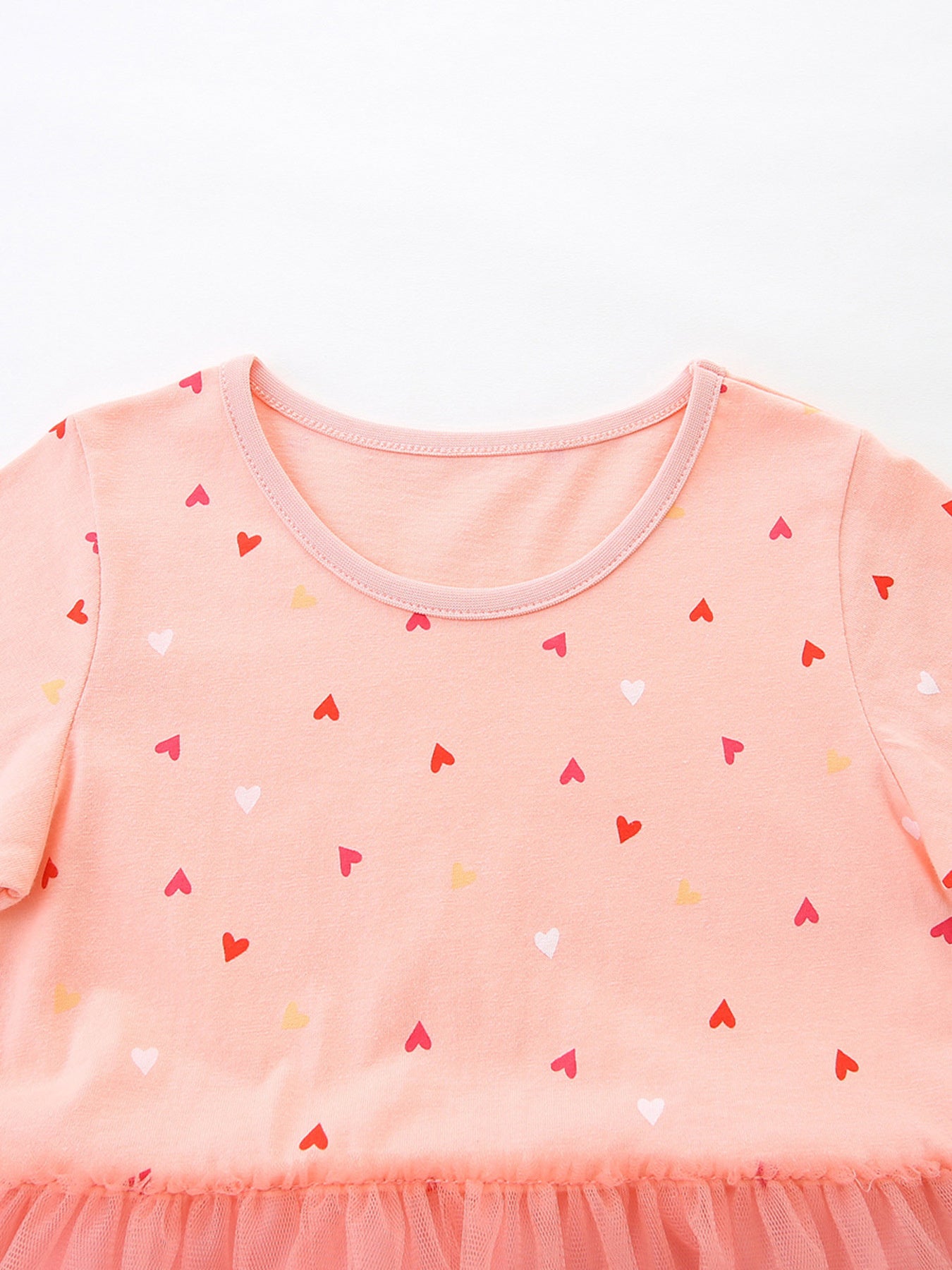 Baby girls' pink cotton dress with allover heart print and tulle hem.