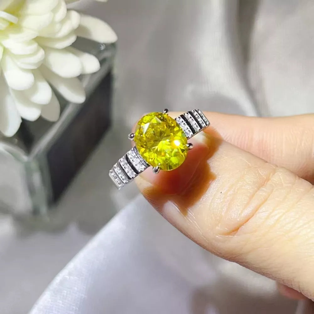 ring in yellow featuring oval cut stone and straight fit