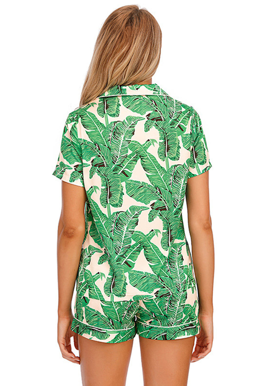 Green botanical print satin pajama set with buttoned top and shorts.